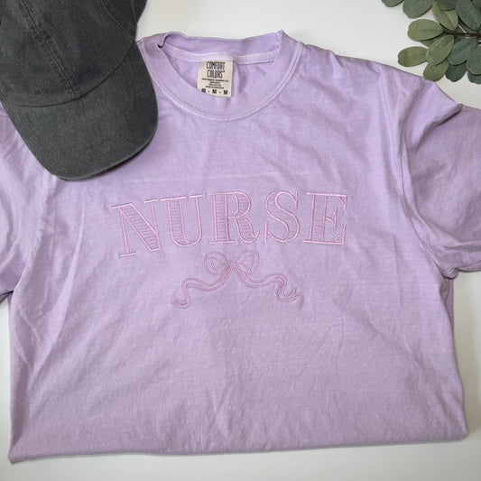 Nurse with Coquette Bow Embroidered Comfort Colors Tee